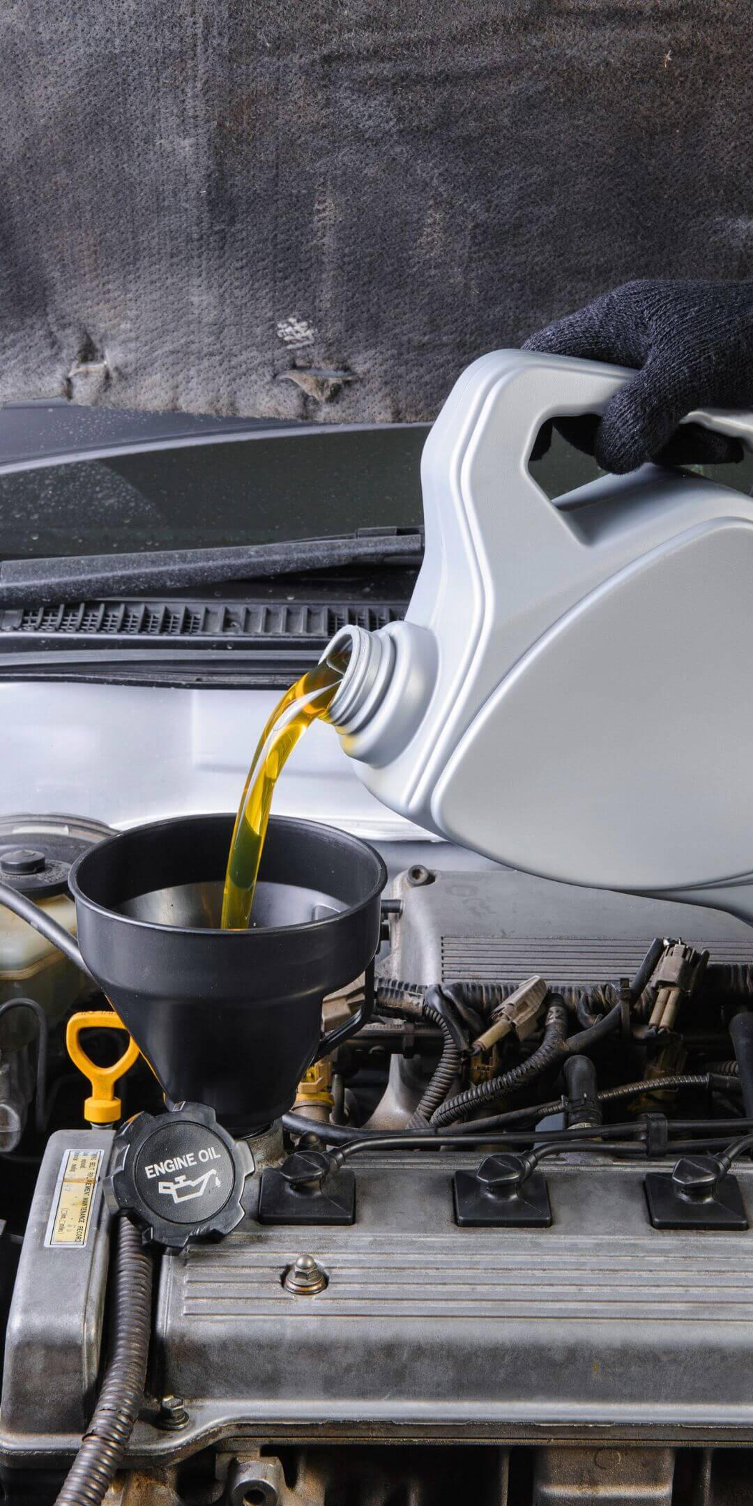 A mobile car repair technician inspecting a vehicle in Slough.