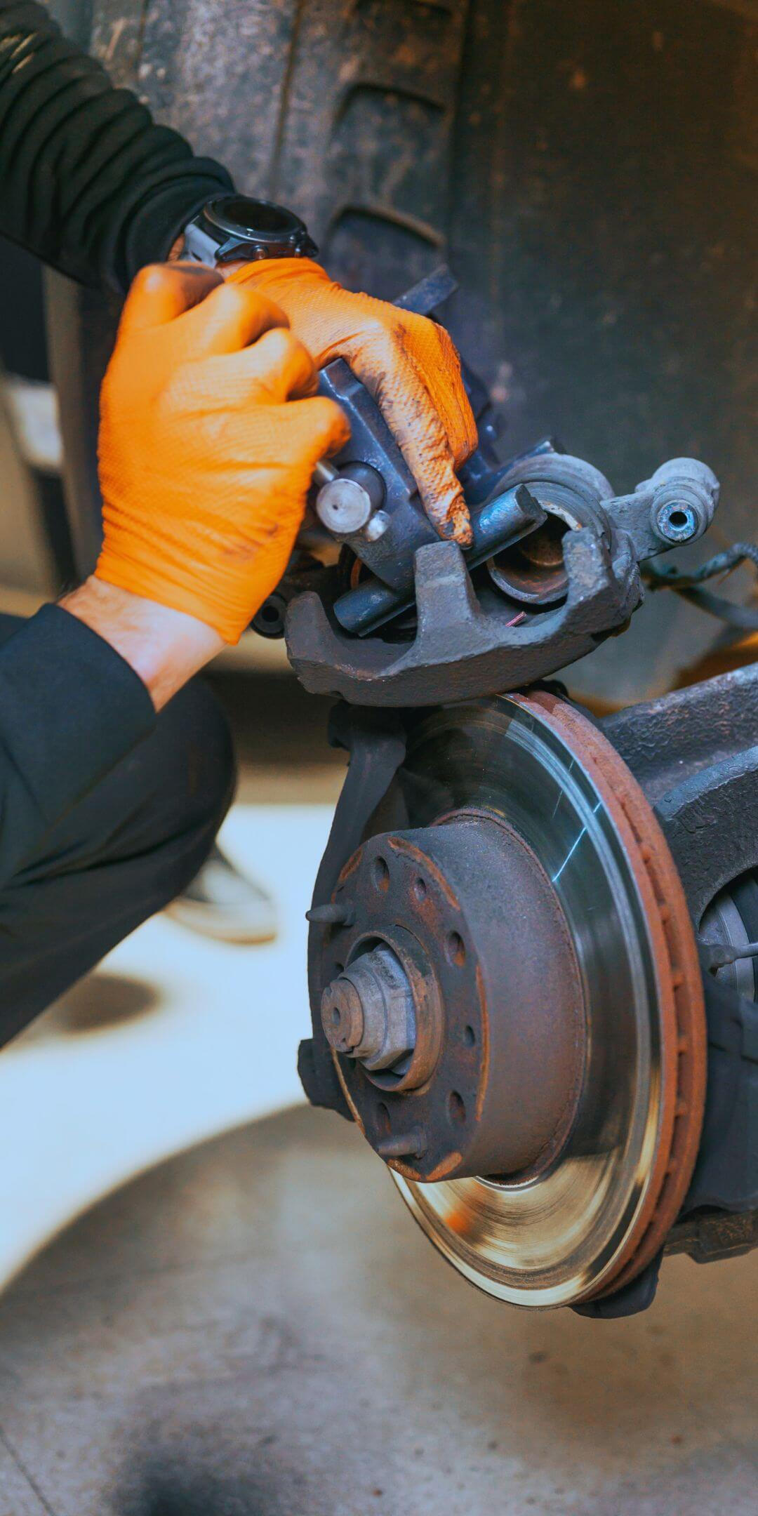 A Maxamy mobile mechanic repairing a car engine in Windsor.