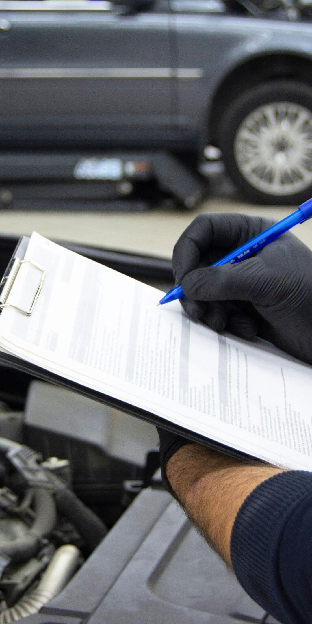 A Maxamy technician performing a pre-purchase inspection for a car buyer in Slough.