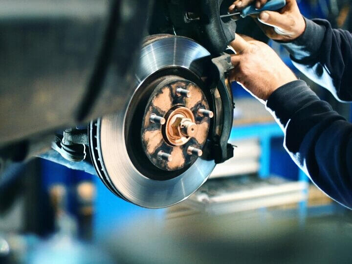 Brake disc repair service during mobile car repair in Maidenhead – Maxamy Mechanic adjusting brake components on a lifted vehicle, showing mobile brake repair service in Maidenhead, Slough, Windsor, and nearby towns.
