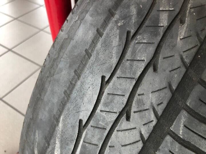 Tyre Wear as a Cause of MOT Failure Worn car tyre tread that contributes to MOT failure due to poor condition